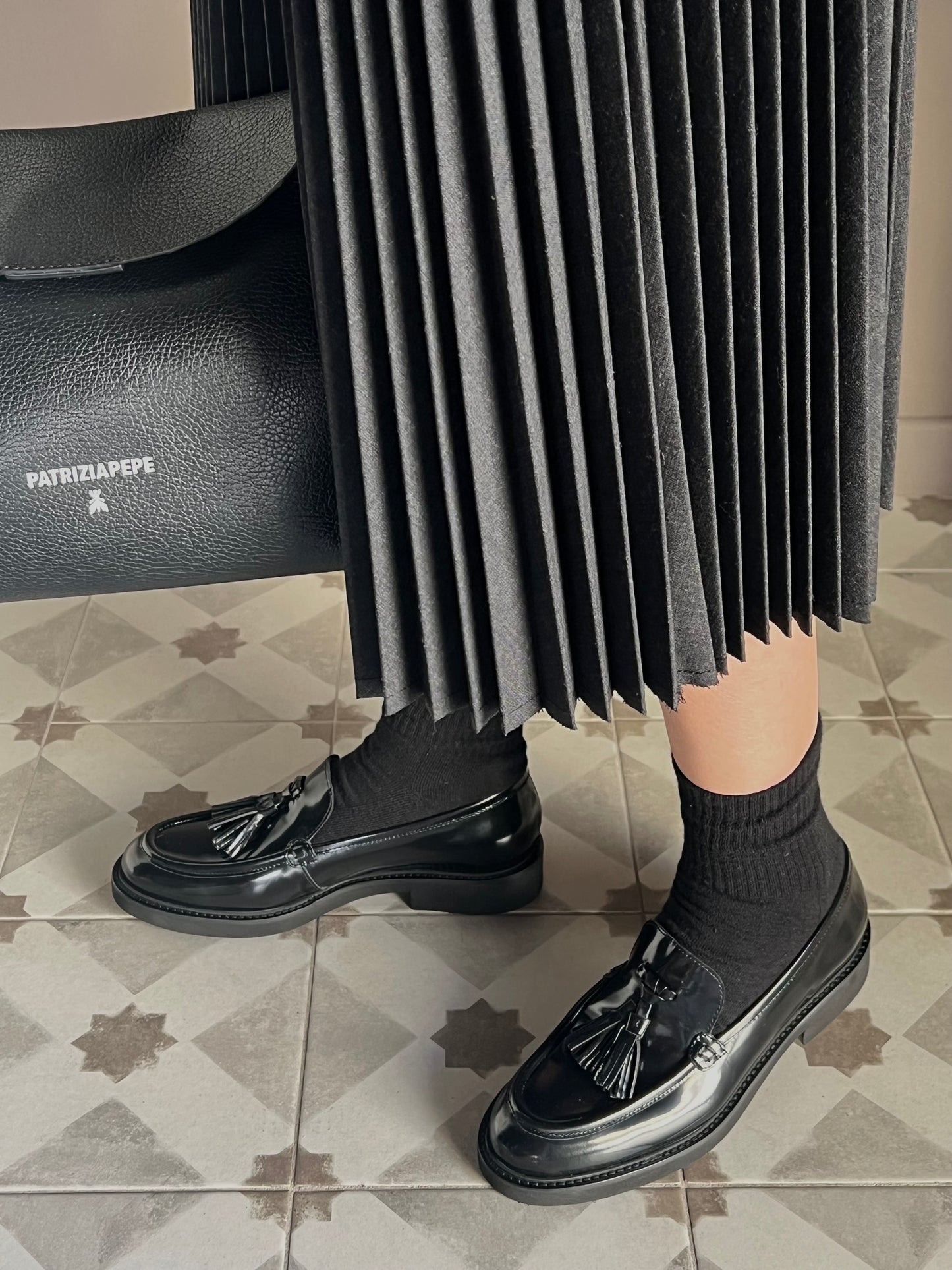 Mocassino in pelle con nappine