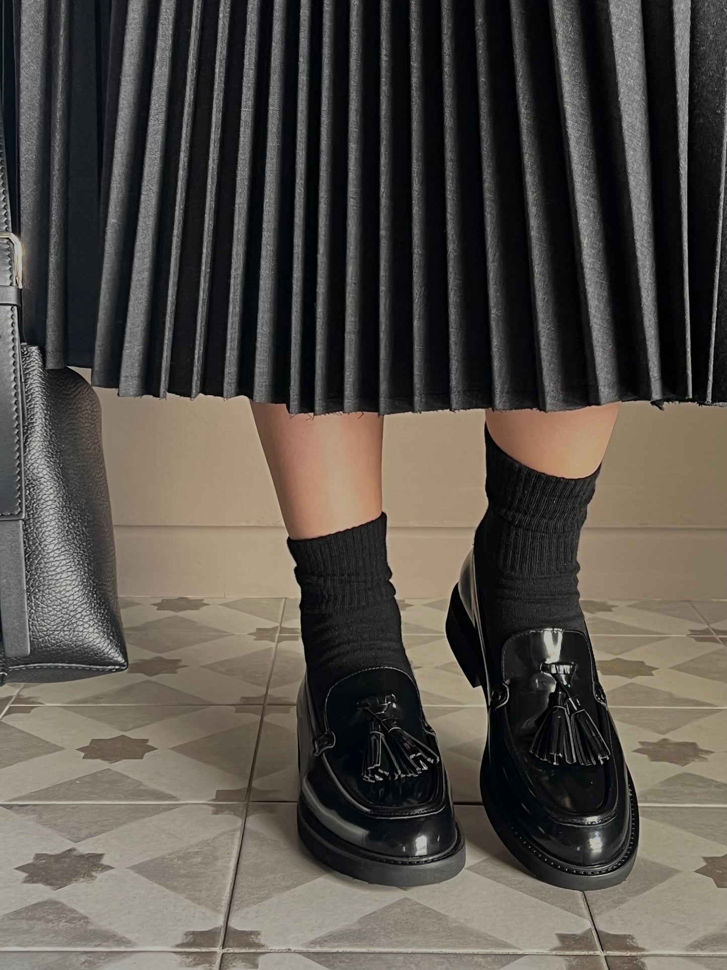 Mocassino in pelle con nappine