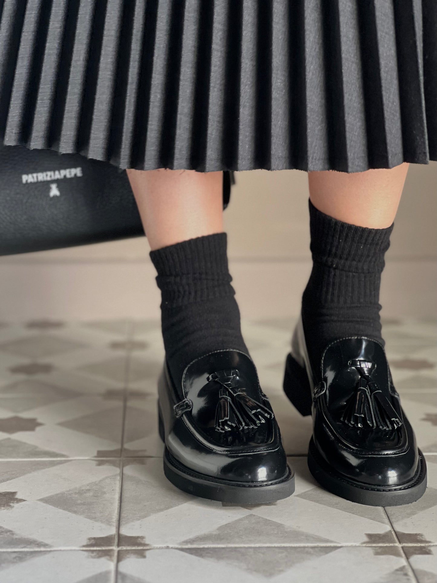 Mocassino in pelle con nappine