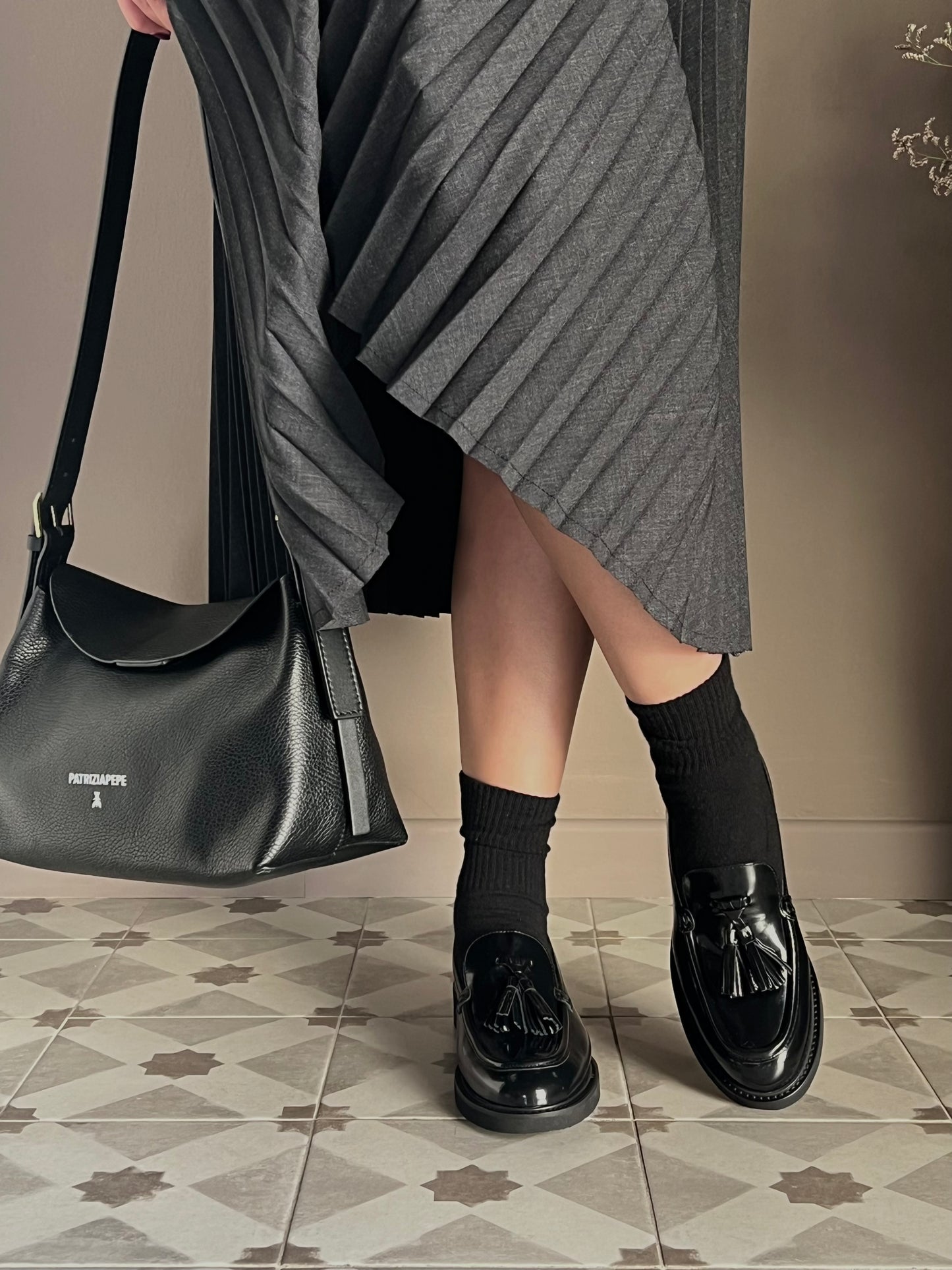 Mocassino in pelle con nappine