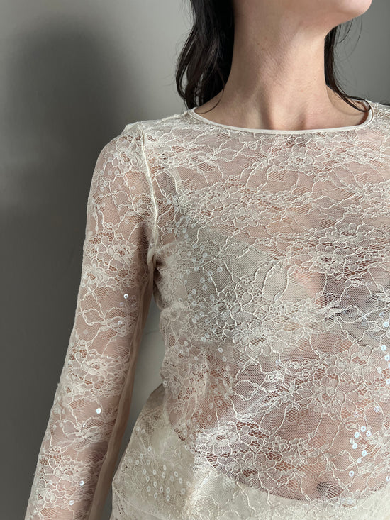 Top a maniche lunghe in pizzo con paillettes