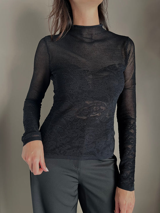 Maglia dolcevita a taglio vivo effetto pizzo