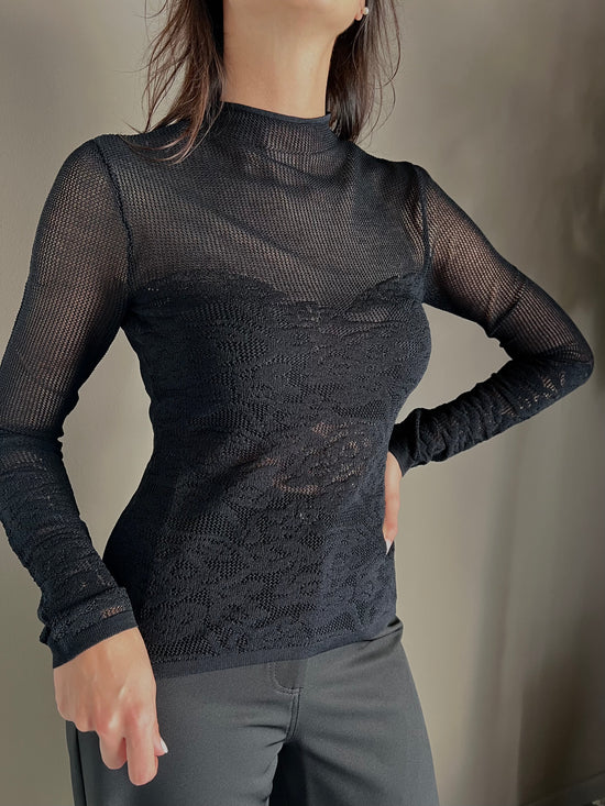 Maglia dolcevita a taglio vivo effetto pizzo