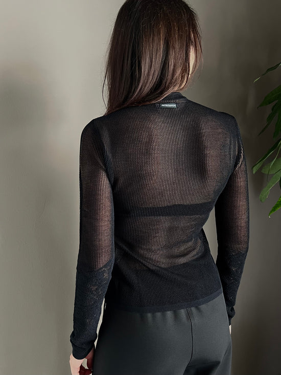 Maglia dolcevita a taglio vivo effetto pizzo