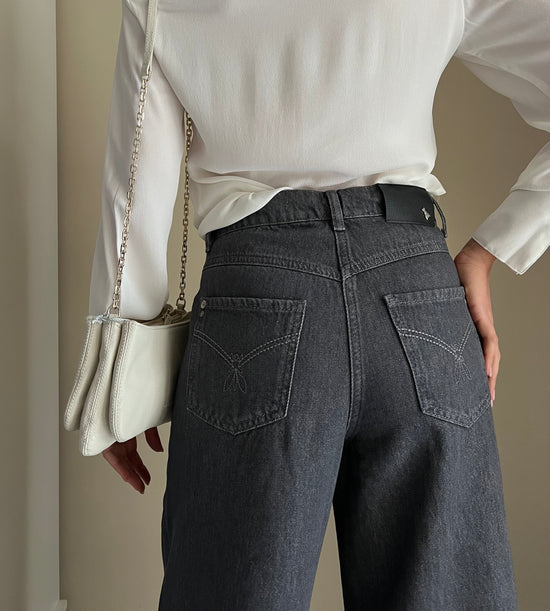 Pantalone denim vita bassa a palazzo grigio