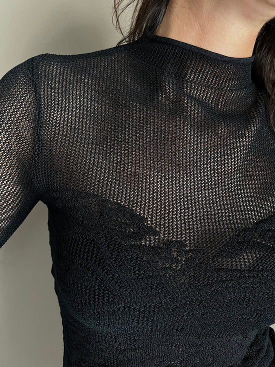 Maglia dolcevita a taglio vivo effetto pizzo