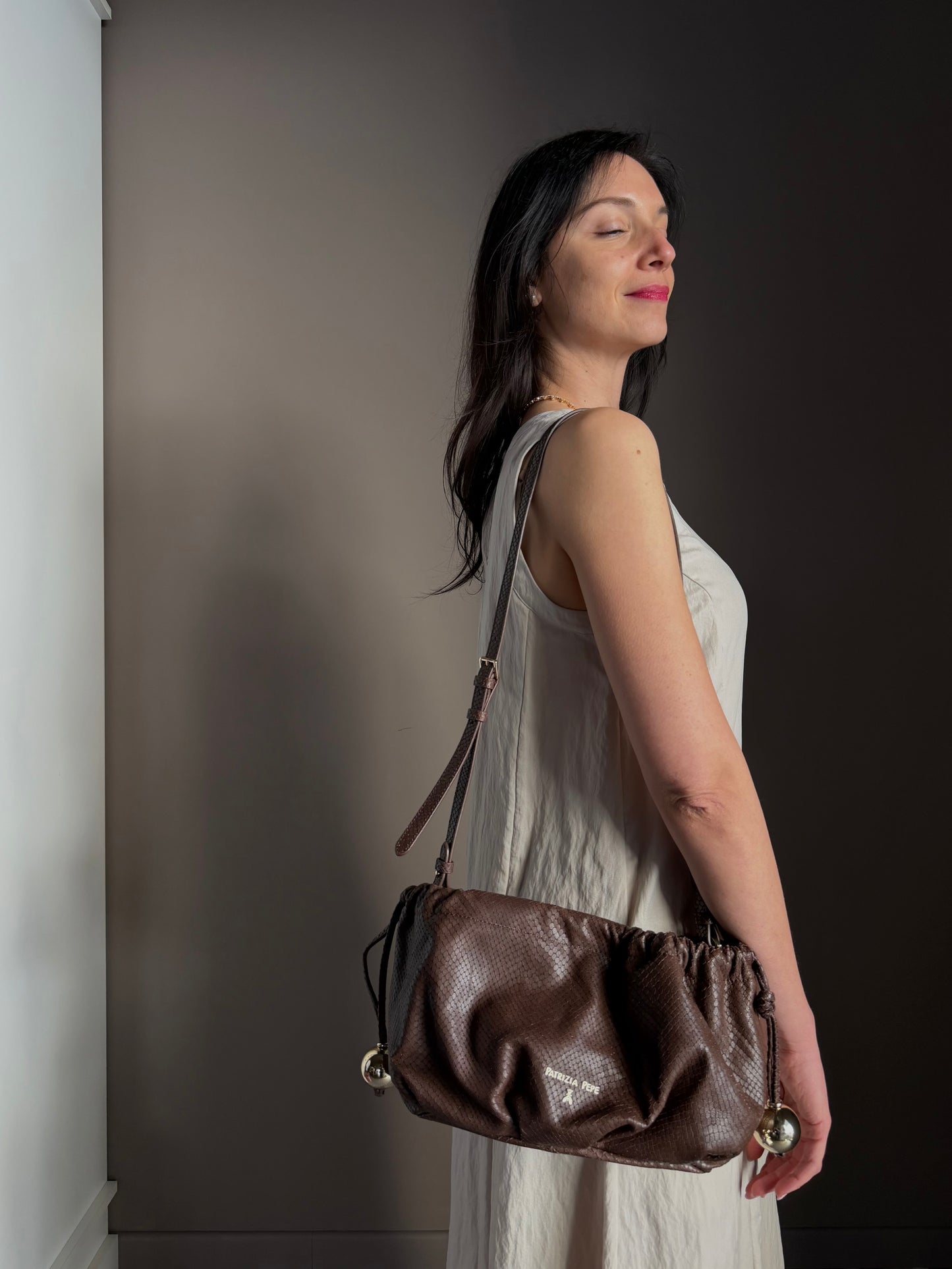 Clutch in Pelle Stampa Pitone – Testa di Moro