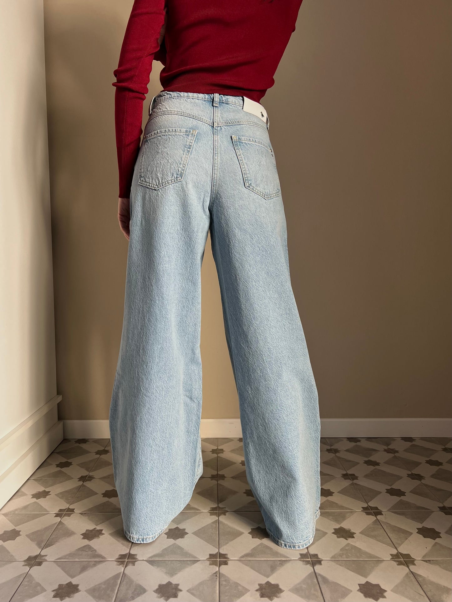 Pantalone jeans vita bassa gamba larga