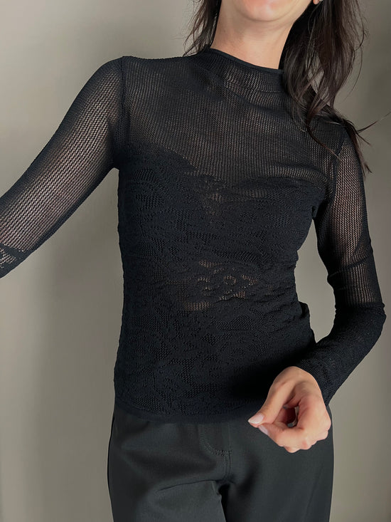 Maglia dolcevita a taglio vivo effetto pizzo