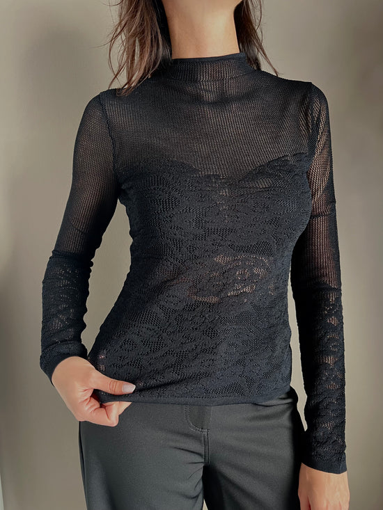 Maglia dolcevita a taglio vivo effetto pizzo