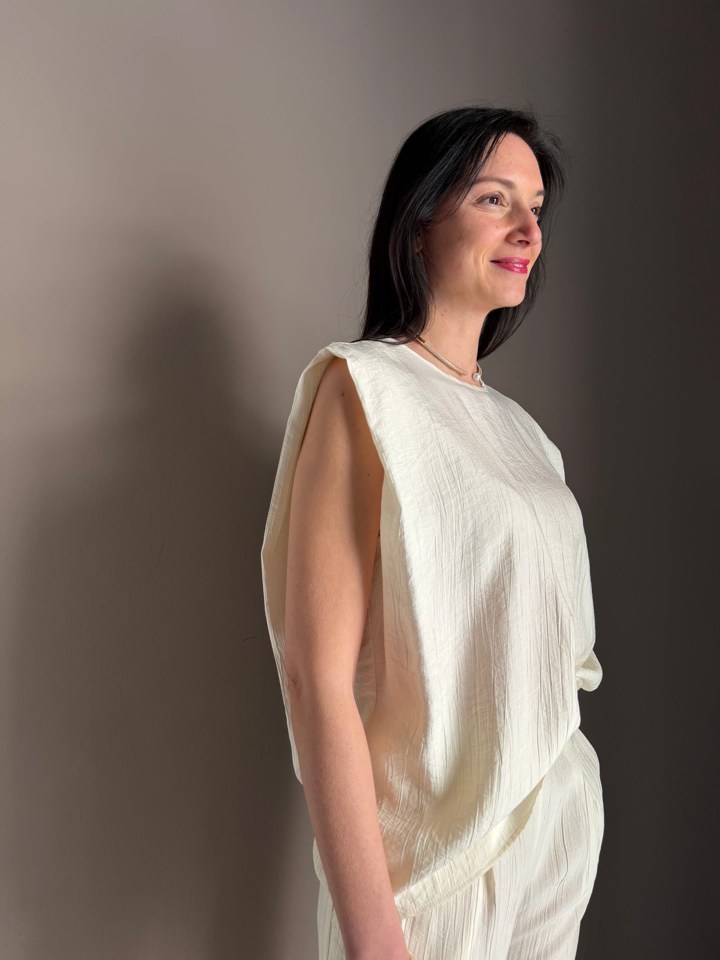 Blusa avorio “fluid sculpt”