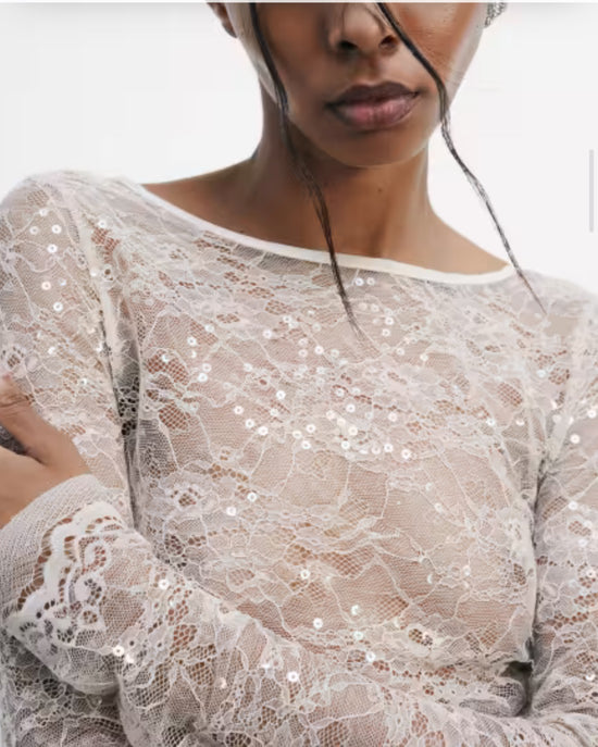 Top a maniche lunghe in pizzo con paillettes